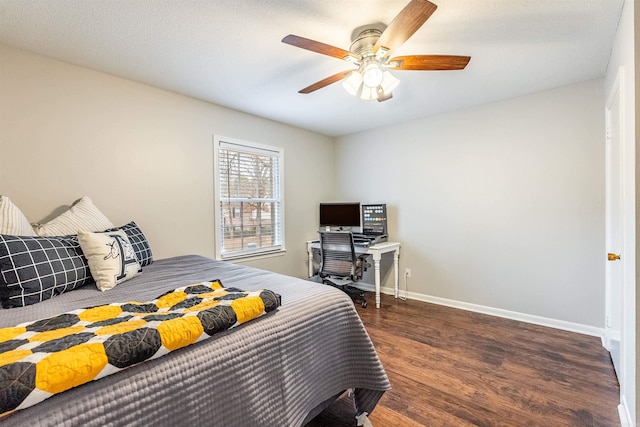 bedroom featuring dark wood-type flooring and ceiling fan