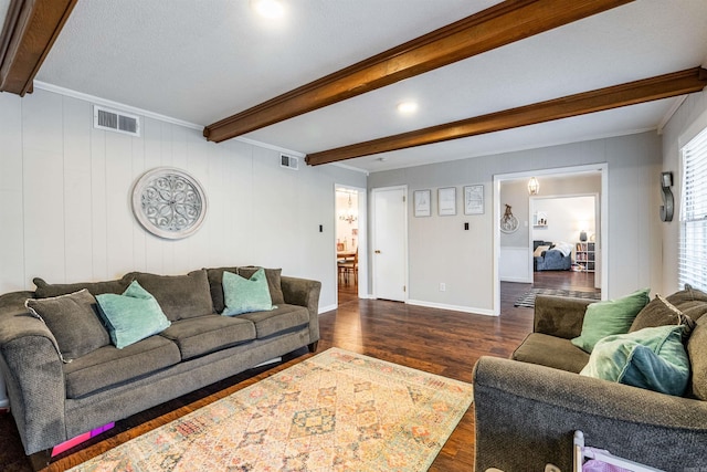 living room with beamed ceiling, crown molding, and dark hardwood / wood-style flooring