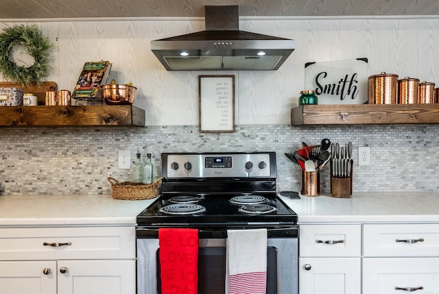 kitchen with white cabinetry, decorative backsplash, island range hood, and stainless steel electric range