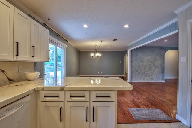 kitchen with crown molding, white cabinetry, and white dishwasher