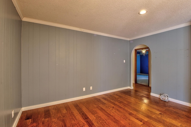 unfurnished room featuring crown molding, a textured ceiling, and hardwood / wood-style floors