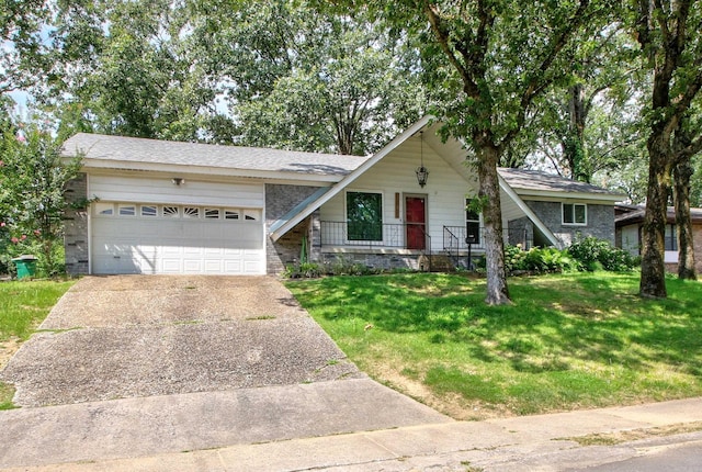 view of front of property featuring a front lawn and a garage