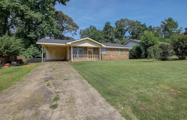 ranch-style home with a front lawn, a carport, and covered porch