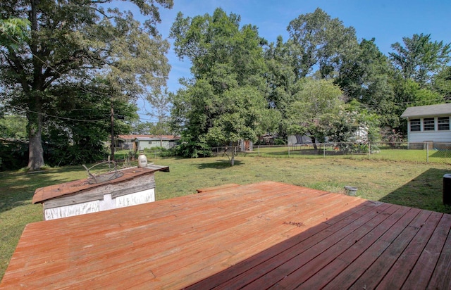 wooden deck with a lawn