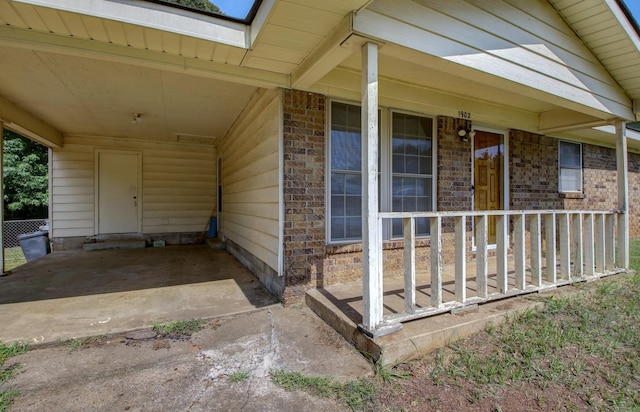 entrance to property with covered porch