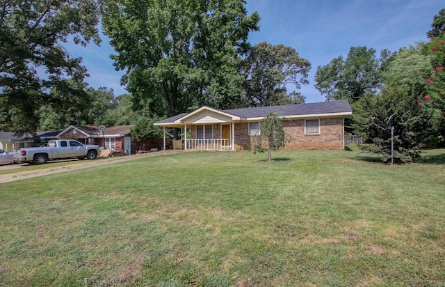 single story home with a porch and a front yard