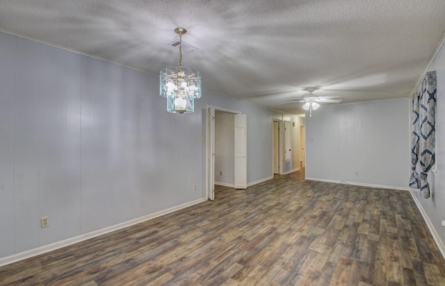 unfurnished room with dark hardwood / wood-style flooring, a textured ceiling, ornamental molding, and ceiling fan