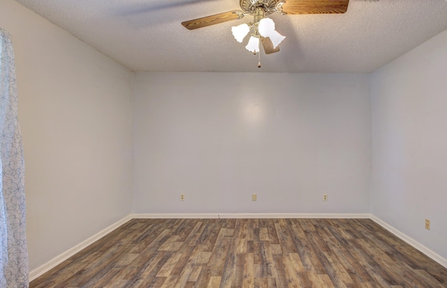 unfurnished room with ceiling fan, a textured ceiling, and dark hardwood / wood-style flooring