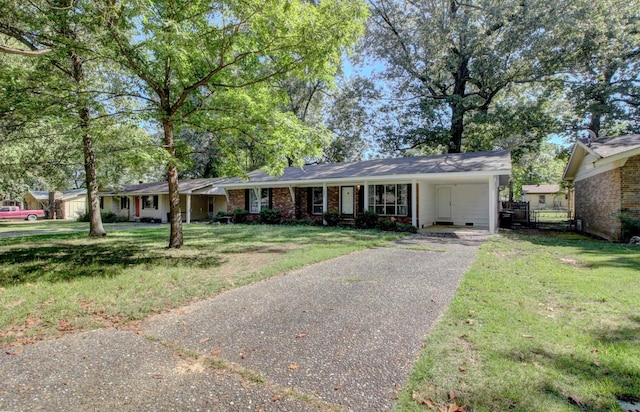 single story home featuring a carport and a front yard