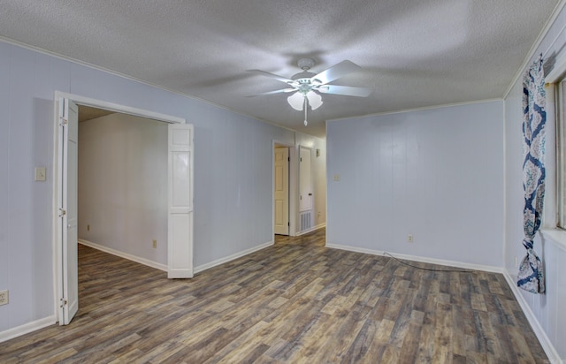 unfurnished room featuring dark hardwood / wood-style flooring, crown molding, a textured ceiling, and ceiling fan