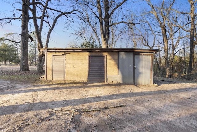 view of outbuilding with a garage