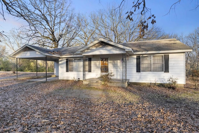 single story home featuring a carport