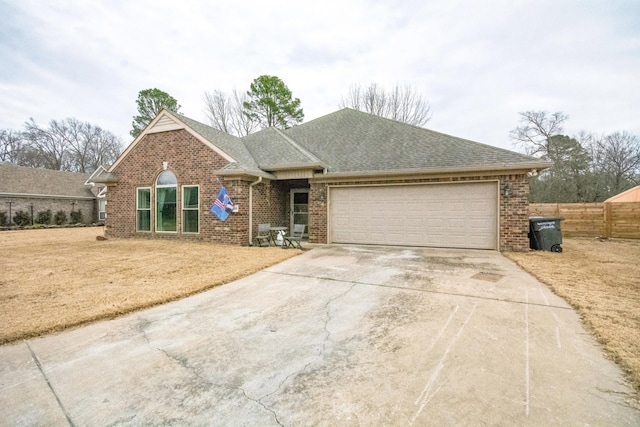 single story home featuring a garage