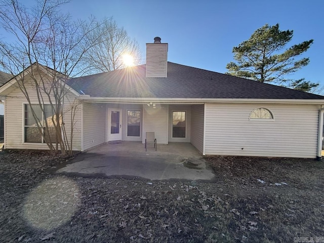 back of house with a patio