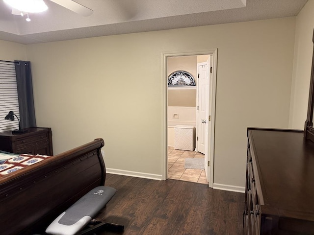 bedroom with hardwood / wood-style flooring and a textured ceiling