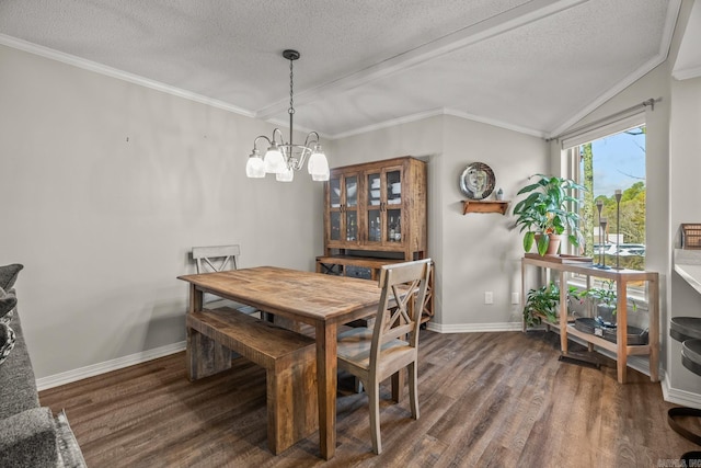 dining area with dark wood-type flooring, crown molding, and a textured ceiling