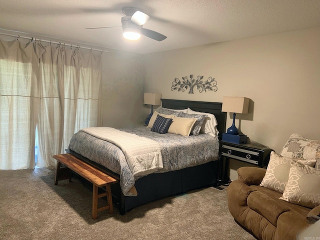 bedroom with light carpet, a textured ceiling, and ceiling fan