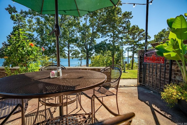 view of patio with a water view