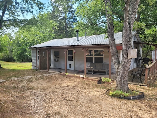 back of house with cooling unit and a patio