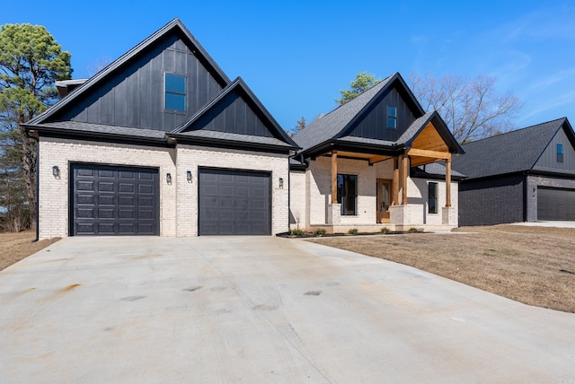 view of front of home with a porch and a garage