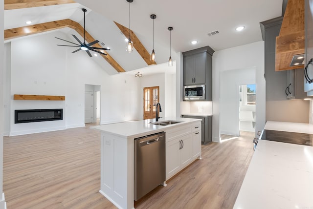 kitchen with white cabinetry, sink, gray cabinetry, ceiling fan, and stainless steel appliances