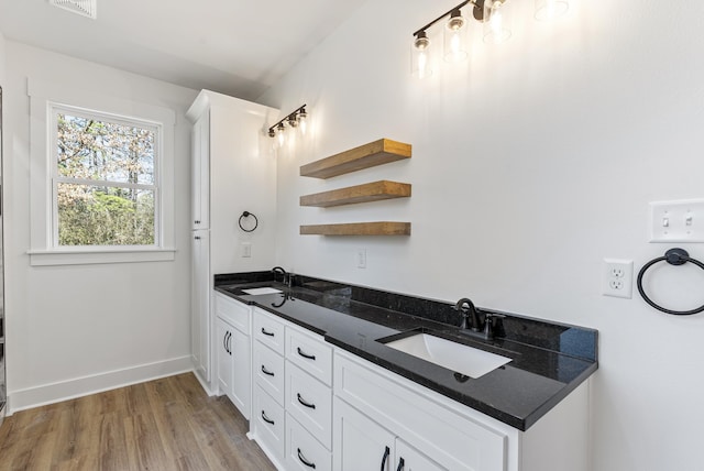 bathroom featuring vanity and wood-type flooring