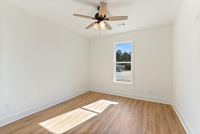 unfurnished room with ceiling fan and light wood-type flooring