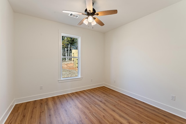 empty room featuring ceiling fan and light hardwood / wood-style floors