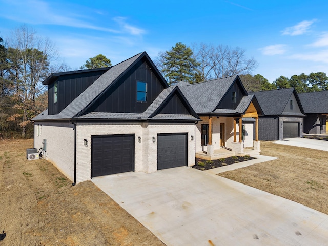 view of front facade featuring a garage and a front lawn