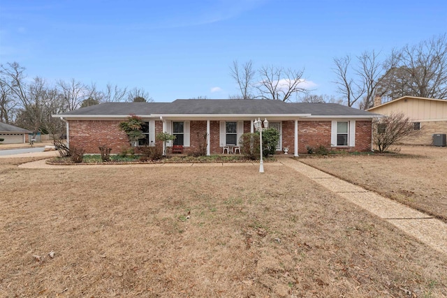 ranch-style home with a front lawn