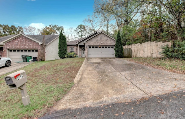 view of front of home featuring a garage and a front yard