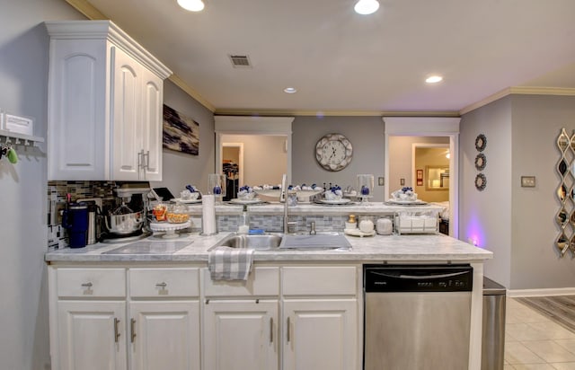 kitchen with dishwasher, sink, white cabinets, decorative backsplash, and crown molding