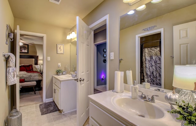 bathroom with tile patterned flooring and vanity