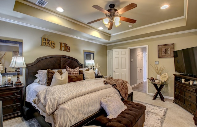 carpeted bedroom with crown molding, ceiling fan, and a raised ceiling