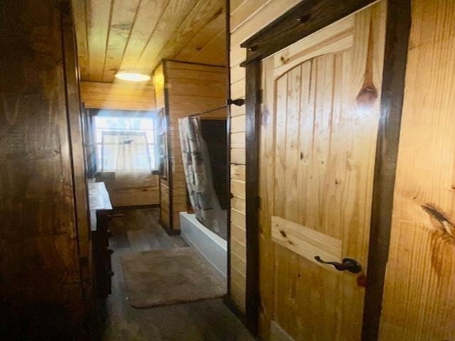 205 S Main, Okolona, AR 71962 - bathroom with shower / bathtub combination with curtain, wood ceiling, and wooden walls