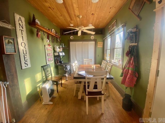 205 S Main, Okolona, AR 71962 - dining space featuring wood ceiling, ceiling fan, and hardwood / wood-style flooring