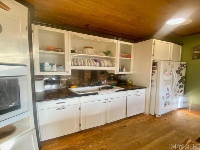 205 S Main, Okolona, AR 71962 - kitchen with wooden ceiling, white refrigerator with ice dispenser, sink, and white cabinets