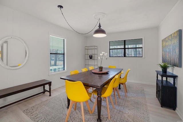 dining space featuring light wood-type flooring