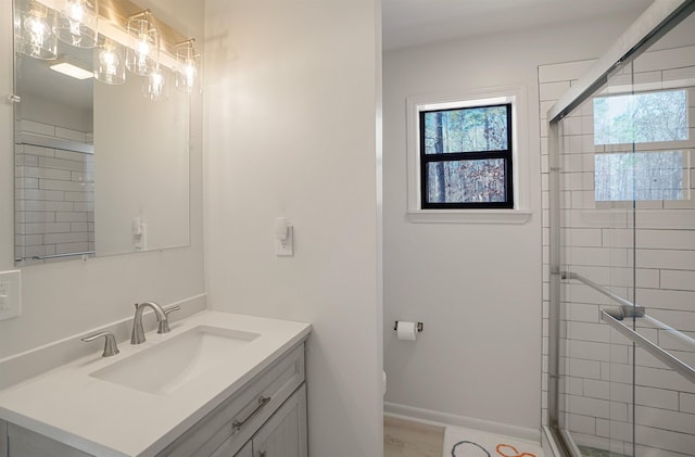 bathroom featuring vanity, a wealth of natural light, toilet, and walk in shower