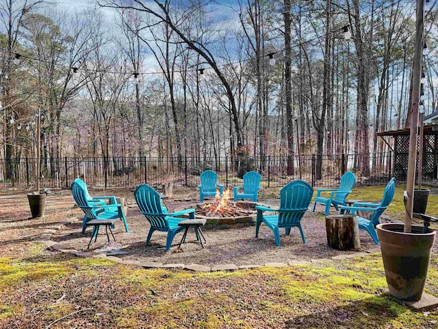 view of yard with an outdoor fire pit