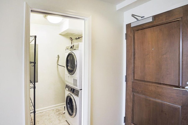 clothes washing area with stacked washer / drying machine