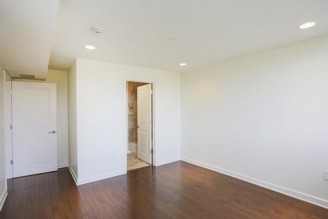 unfurnished bedroom featuring dark hardwood / wood-style flooring