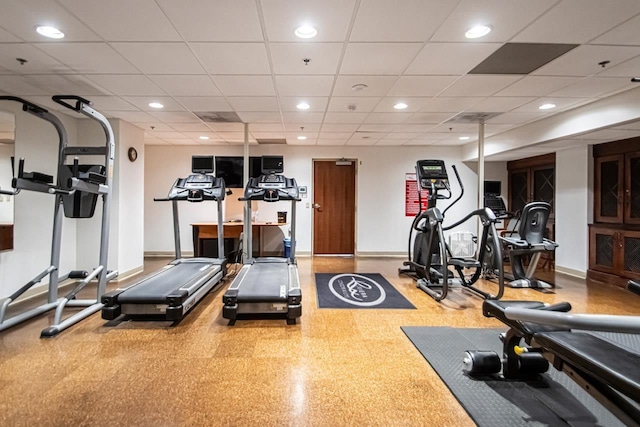 exercise area featuring a paneled ceiling