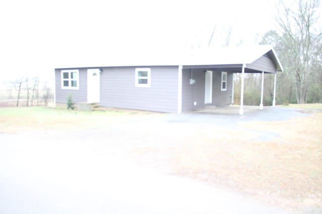 ranch-style home with a carport