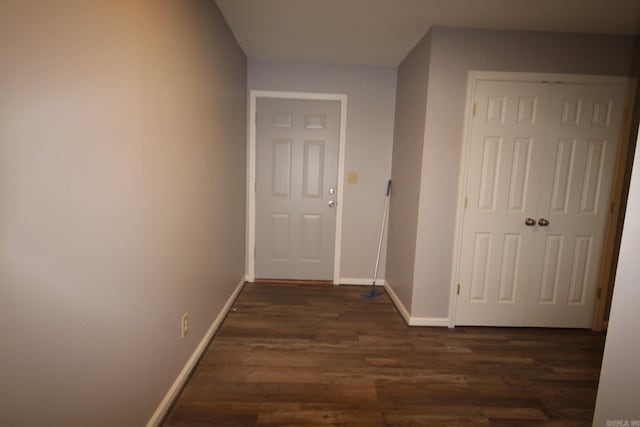 hallway featuring dark hardwood / wood-style flooring