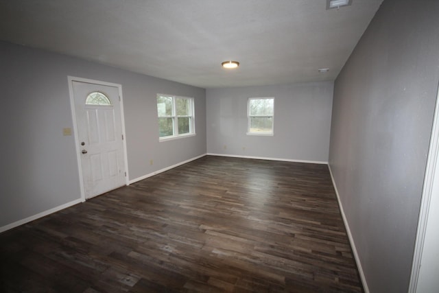 entrance foyer featuring dark hardwood / wood-style floors