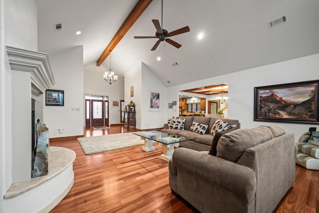 living room with wood-type flooring, high vaulted ceiling, ceiling fan with notable chandelier, and beam ceiling