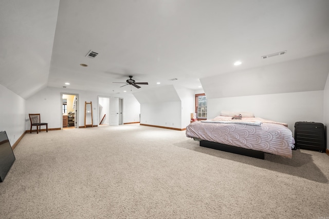 carpeted bedroom with vaulted ceiling and ceiling fan