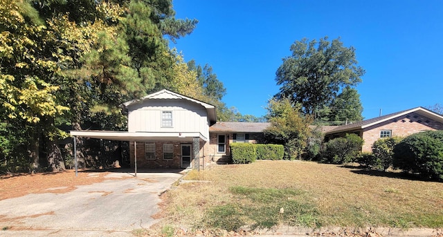 view of front of house with a front lawn and a carport