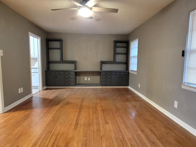 interior space with ceiling fan and light wood-type flooring